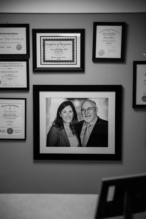 Pictures hanging on a wall of {PRACTICE_NAME}