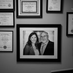 Pictures hanging on a wall of {PRACTICE_NAME}